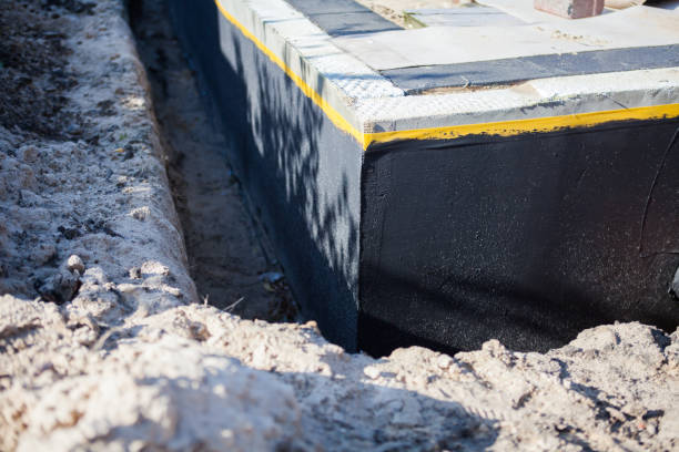 Professional Basement Waterproofing technician working in Dayton, MD